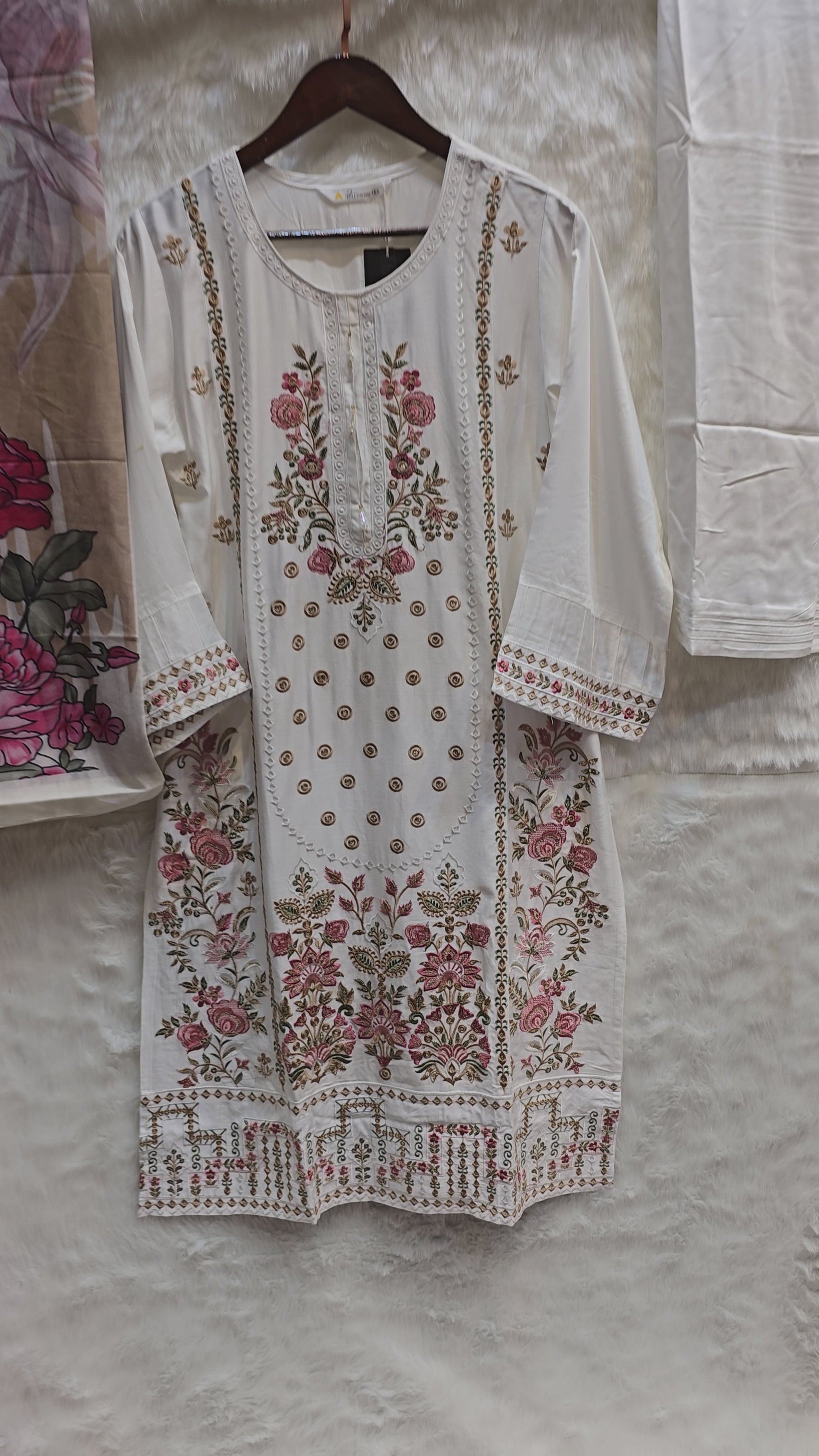 GIZA COTTON WITH MULTI EMBROIDERY AND TUSSELS ON THE NECK